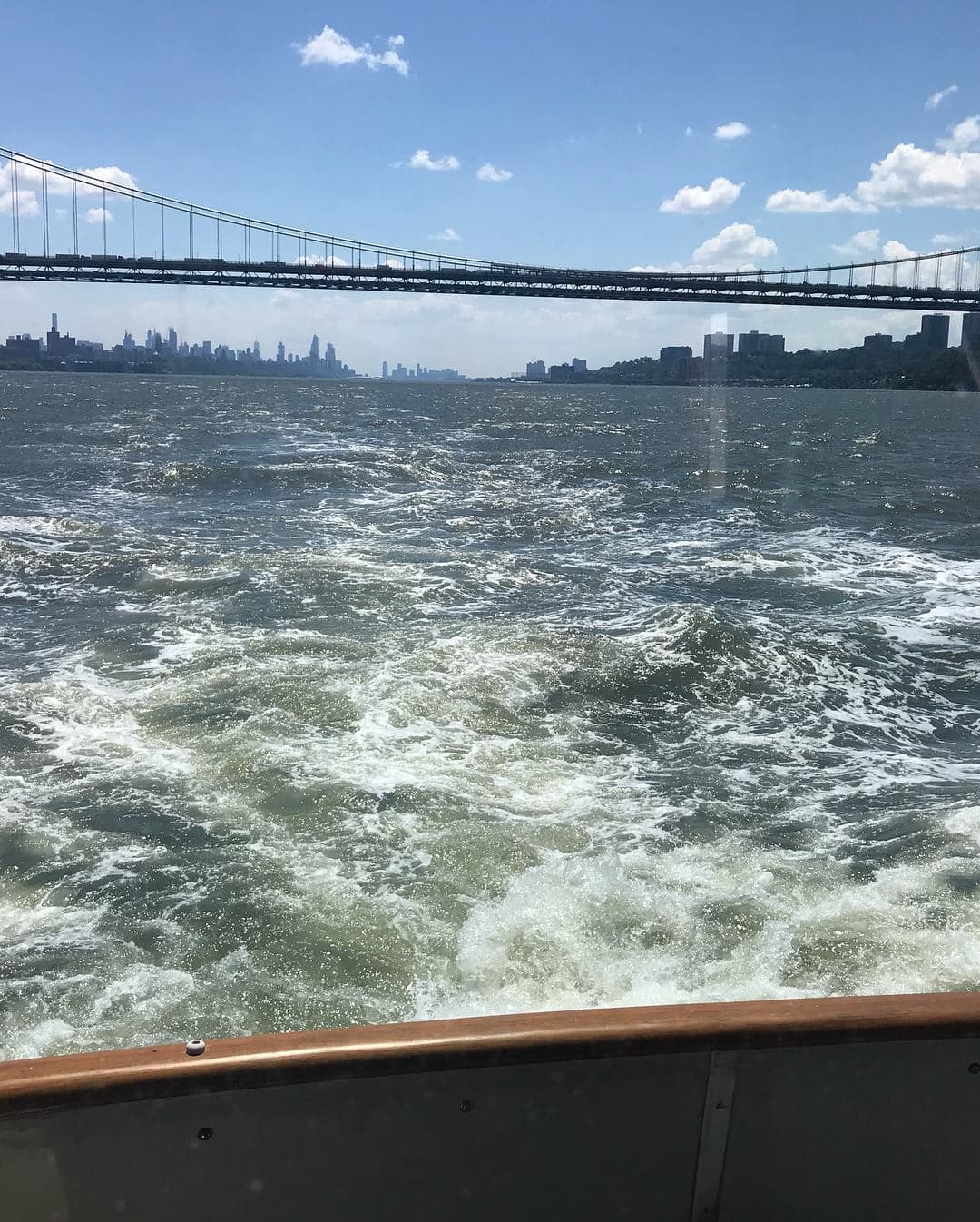 Looking back at NYC skyline from the boat
