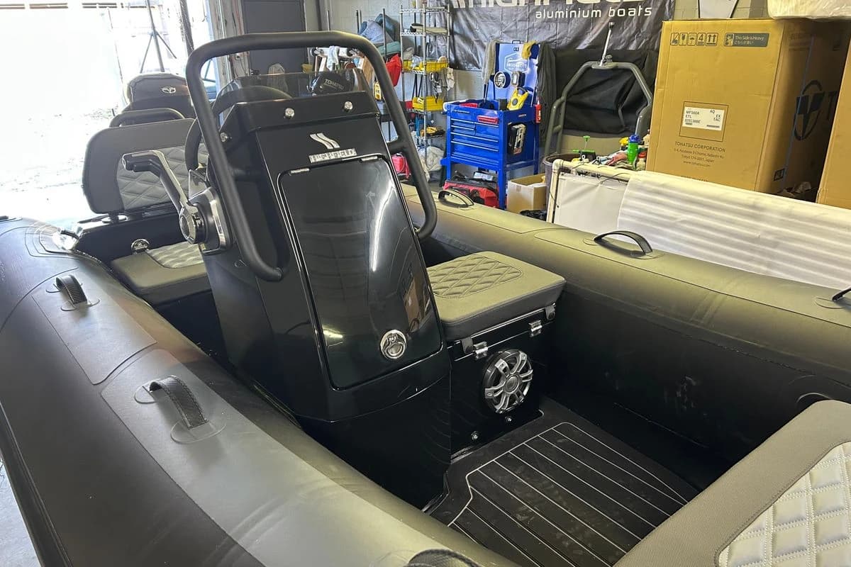 2025 Highfield Sport 360 inflatable boat interior with steering console and seating.