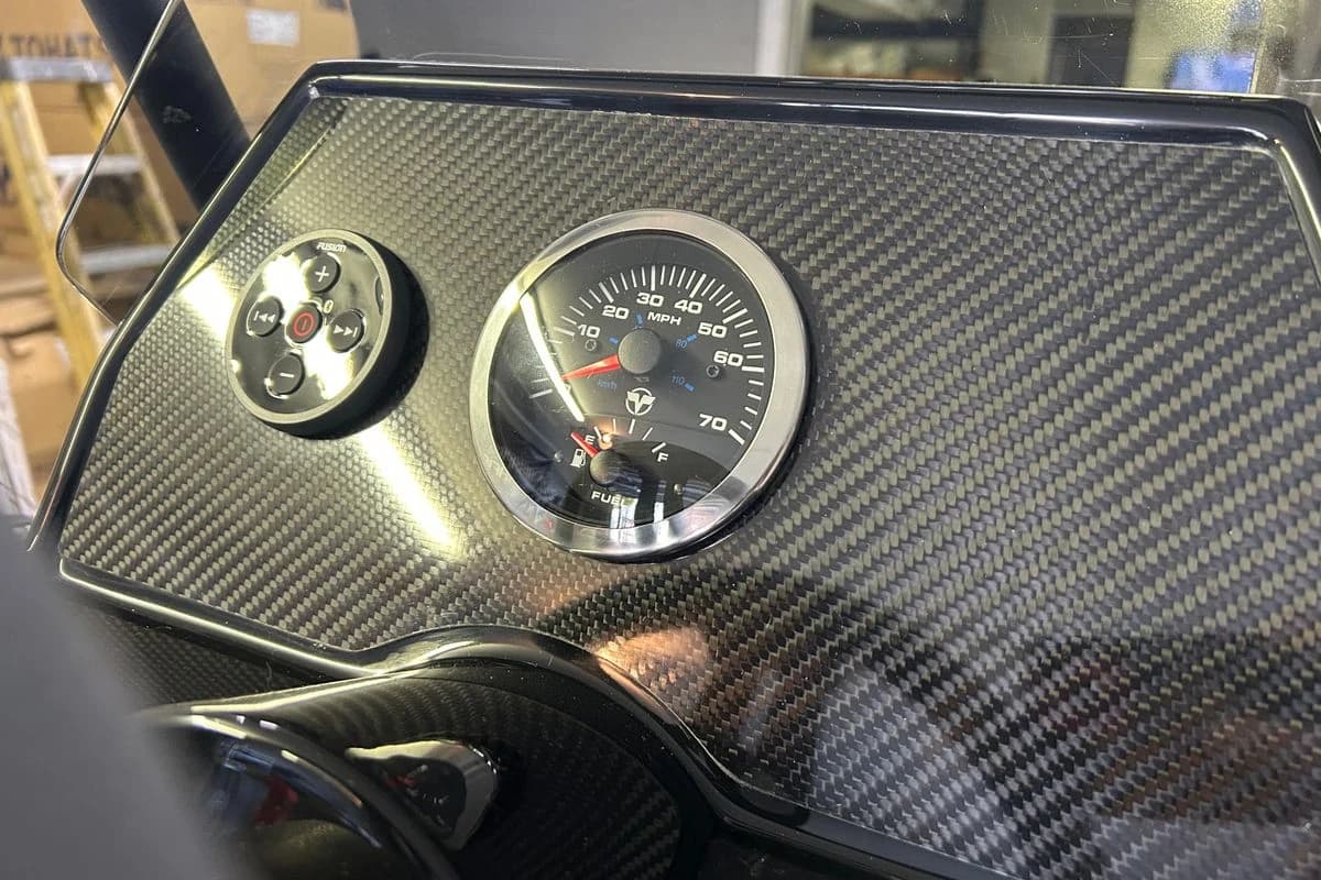 Carbon fiber dashboard of 2025 Highfield Sport 360 with speedometer and control panel.