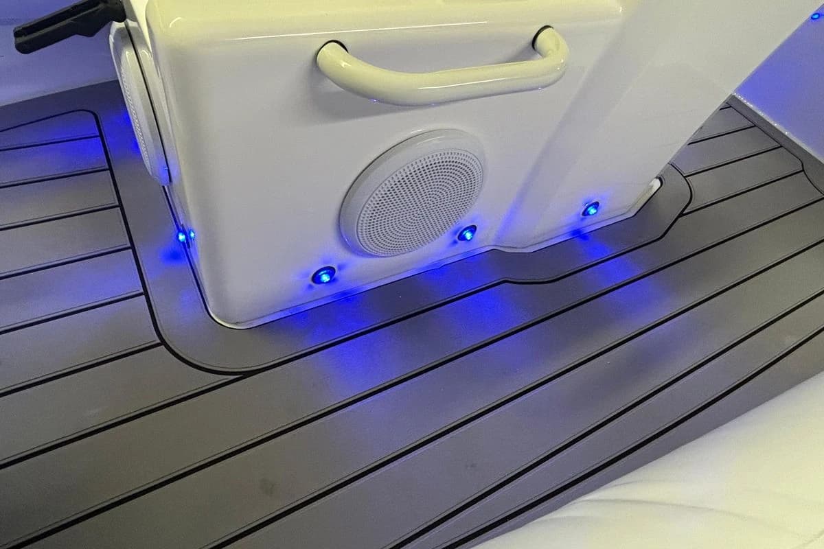 2025 Highfield Sport 390 boat interior with blue LED lights and speaker system.