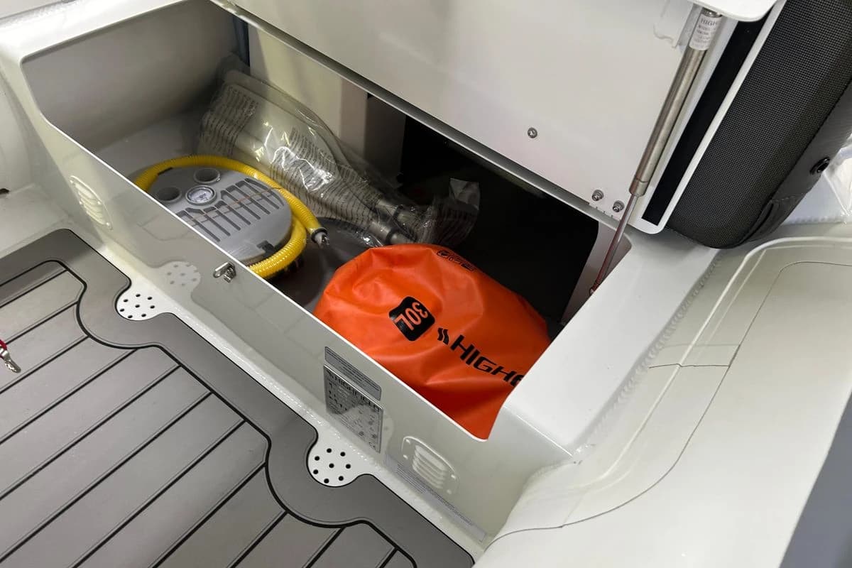 Storage compartment of 2025 Highfield Sport 390 boat with equipment and accessories.
